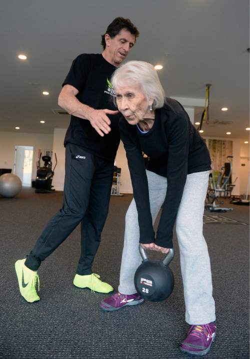 Al Hartmann  |  The Salt Lake Tribune
Fitness trainer Paul Holbrook spots 86-year-old Jinnah Kelson in a weight lift to develop strength at The Age Performance center in Sugarhouse Tuesday Nov. 10.  She can lift 80 and even 100 pounds in the excercise. The center is celebrating its 10th anniversary of training older adults with specific strength programs.