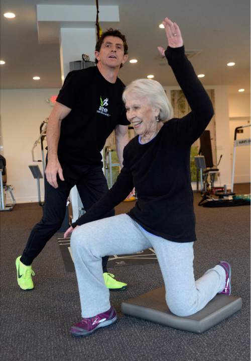 Al Hartmann  |  The Salt Lake Tribune
Fitness trainer Paul Holbrook coaches 86-year-old Jinnah Kelson in an excercise to work on balance and core strength at The Age Performance center in Sugarhouse Tuesday Nov. 10.  The center is celebrating its 10th anniversary of training older adults with specific strength programs.
