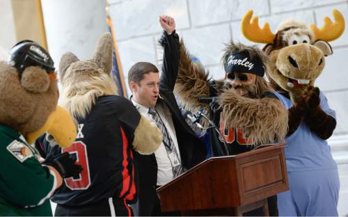 Francisco Kjolseth  |  The Salt Lake Tribune 
Sen. Aaron Osmond, R-South Jordan, is joined by members of the Mascot Miracles Foundation as he is cheered after announcing plans to introduce a state license plate as a way to bring in revenue for childhood illnesses such as cancer on Monday, March, 9, 2015, in the rotunda of the Utah Capitol.