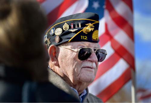 Scott Sommerdorf   |  The Salt Lake Tribune
Veteran Captain Bill Gordon looks at the Taylorsville Veteran's Day Parade from his perch in the back of a military vehicle, Wednesday, November 11, 2015.