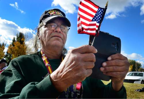 Scott Sommerdorf   |  The Salt Lake Tribune
Viet Nam veteran Gilbert Arredondo makes photos at the Taylorsville Veteran's Day Parade, Wednesday, November 11, 2015.