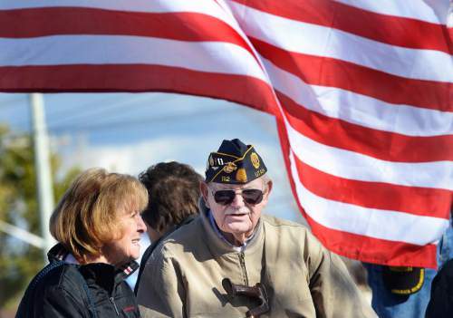 Scott Sommerdorf   |  The Salt Lake Tribune
Veteran Captain Bill Gordon looks at the Taylorsville Veteran's Day Parade from his perch in the back of a military vehicle, Wednesday, November 11, 2015.