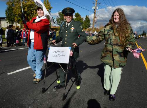 Scott Sommerdorf   |  The Salt Lake Tribune
Viet Nam veteran Phillip Gonzalez marches with his walker in the Taylorsville Veteran's Day Parade, Wednesday, November 11, 2015.