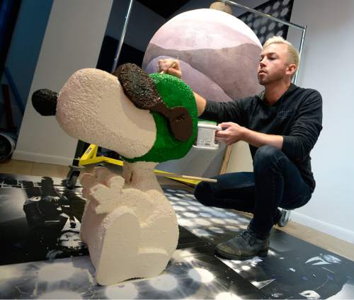 Al Hartmann  |  The Salt Lake Tribune
Macy's artist-designer Zach Albrecht paints "Snoopy" part of an elaborate Christmas window display, many made with made of thousands of individual pieces of candy in their downtown Salt Lake City store at City Creek on Wednesday. It will be a Charlie Brown Christmas theme.