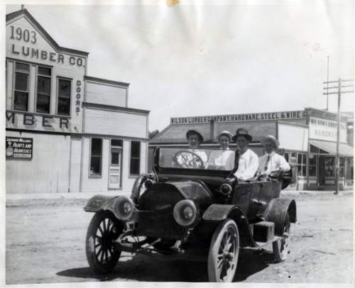 Tribune file photo

A group of men ride in one of the first cars to be owned in Tremonton, Utah. The upper floor of the lumber company behind them was a dancehall that opened on Christmas Eve, 1903.