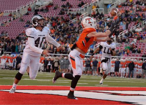 Scott Sommerdorf   |  The Salt Lake Tribune
Timpview WR Sterling Evans catches a TD pass behind Highland's Devon Seui, and brings the score to 42-27. Timpview defeated Highland 49-27 in a 4A semi-final game played at Rice-Eccles stadium, Thursday, November 12, 2015.