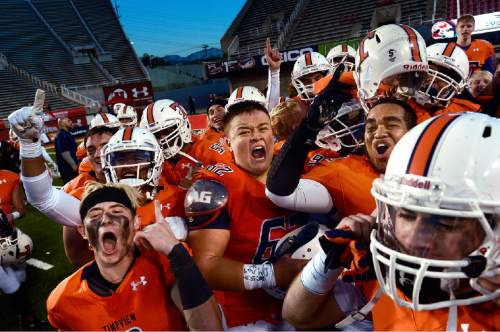 Scott Sommerdorf   |  The Salt Lake Tribune
Timpview players celebrate and play to the cameras after they defeated Highland 49-27 in a 4A semi-final game played at Rice-Eccles stadium, Thursday, November 12, 2015.