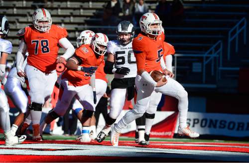 Scott Sommerdorf   |  The Salt Lake Tribune
Timpview QB Kani Neves runs for a 2 yd TD to tie the game at 7-7 in first half play. Timpview led Highland 21-19 at the half in a 4A semi-final game played at Rice-Eccles stadium, Thursday, November 12, 2015.