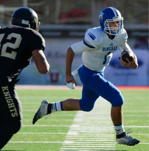 Steve Griffin  |  The Salt Lake Tribune

Bingham quarterback Matthew Degn sweeps around the end during the Class 5A football semifinal between Lone Peak and Bingham at Rice-Eccles Stadium in Salt Lake City, Friday, November 13, 2015. Degn was injured on the play and did not return.