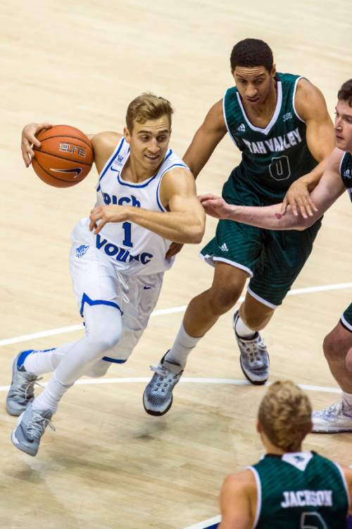 Chris Detrick  |  The Salt Lake Tribune
BYU guard Chase Fischer (1) runs past UVU guard Marcel Davis (0) during the game at the Marriott Center Friday November 13, 2015.