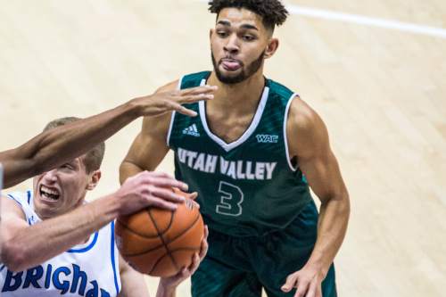 Chris Detrick  |  The Salt Lake Tribune
BYU forward Kyle Davis (21) shoots past UVU guard Telly Davenport (3) during the game at the Marriott Center Friday November 13, 2015.