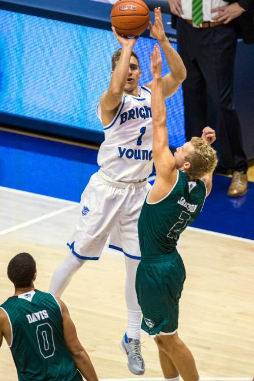 Chris Detrick  |  The Salt Lake Tribune
BYU guard Chase Fischer (1) shoots over UVU guard Jaden Jackson (2) during the game at the Marriott Center Friday November 13, 2015.