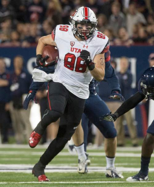 Rick Egan  |  The Salt Lake Tribune

Utah Utes tight end Harrison Handley (88) runs for a touchdown,  giving the Utes a 24-20 lead early in the second half,  in PAC-12 action against the Arizona Wildcats, in Tucson, Saturday, November 14, 2015.