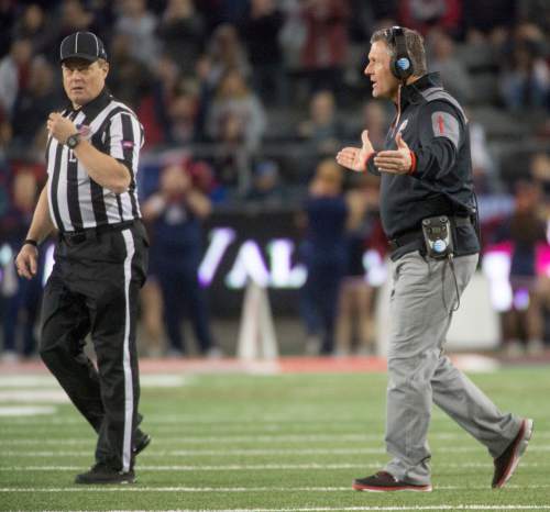 Rick Egan  |  The Salt Lake Tribune

Utah Utes head coach Kyle Whittingham tries to talk to the official, in PAC-12 action against the Arizona Wildcats, in Tucson, Saturday, November 14, 2015.