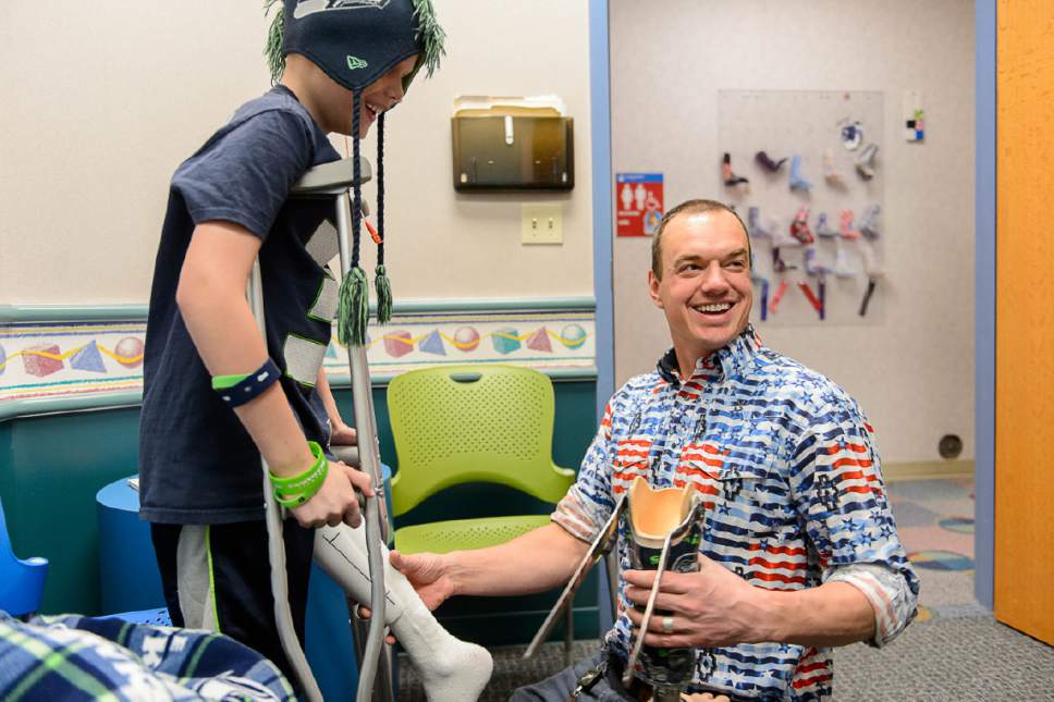 Trent Nelson  |  The Salt Lake Tribune
James Knackstedt fits patient David Steen, left, with a prosthetic at Shriners Hospital in Salt Lake City on Wednesday.