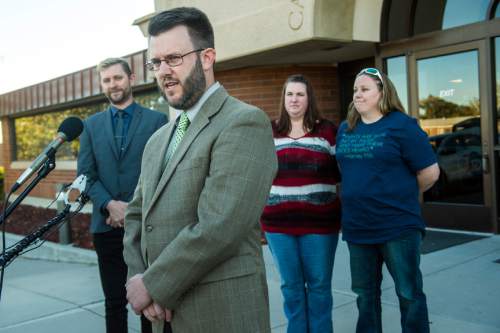 Chris Detrick  |  The Salt Lake Tribune
Attorney Jim Hunnicutt, Equality Utah Executive Director Troy Williams, April Hoagland, Beckie Peirce during a press conference outside of the Juvenile Court in Price, Utah Friday November 13, 2015. Seventh District Juvenile Judge Scott Johansen has amended an order to remove a 9-month-old girl from the Price home of her same-sex foster parents and has instead scheduled a hearing on the matter.