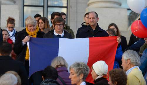 Leah Hogsten  |  The Salt Lake Tribune
French organizations, including Alliance FranÁaise de Salt Lake City, held a vigil at the Utah Capitol, in the wake of the terrorist attacks in Paris to show support for the City of Light and its people. The remembrance was followed by a religious vigil at 5 p.m., Sunday, November 15, 2015.