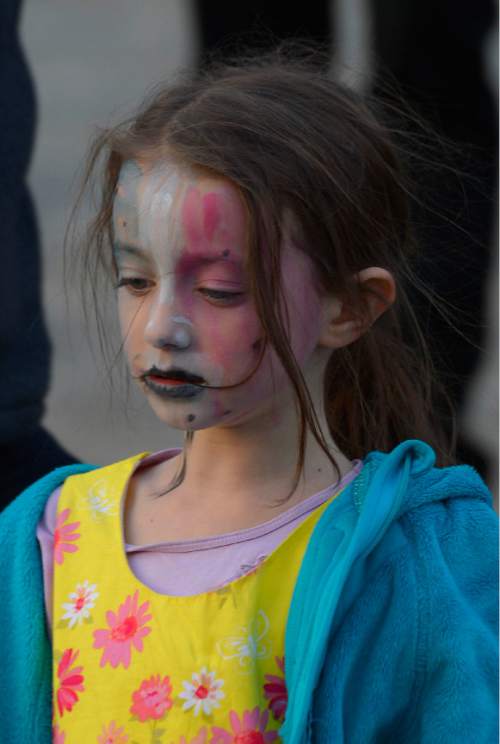 Leah Hogsten  |  The Salt Lake Tribune
Lea Chevance, 6, painted the French flag on her face for the vigil. French organizations, including Alliance Française de Salt Lake City, held a vigil at the Utah Capitol, in the wake of the terrorist attacks in Paris to show support for the City of Light and its people. The remembrance was followed by a religious vigil at 5 p.m., Sunday, November 15, 2015.