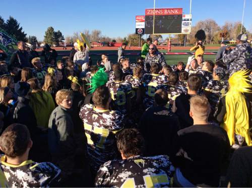 Tom Zulewski  |  Special to the Tribune

DR players celebrate with championship trophy after defeating Kanab 23-20 in 1A title game Nov. 14, 2015 at Eccles Coliseum in Cedar City.
Second one: Diamond Ranch assistant coach delivers a speech to the team after they defeated Kanab 23-20 in the 1A football title game Saturday at Eccles Coliseum in Cedar City.
