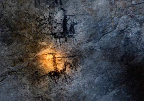 Scott Sommerdorf   |  The Salt Lake Tribune
The warm light from a flashlight illuminates ancient cave art inside Danger Cave near Wendover, Saturday, November 14, 2015.