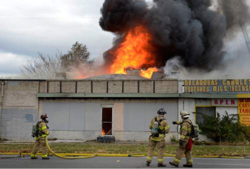 Rick Egan | The Salt Lake Tribune

Salt Lake City fire fighters battle a fire at 1500 South Main Street, Wednesday, November 18, 2015