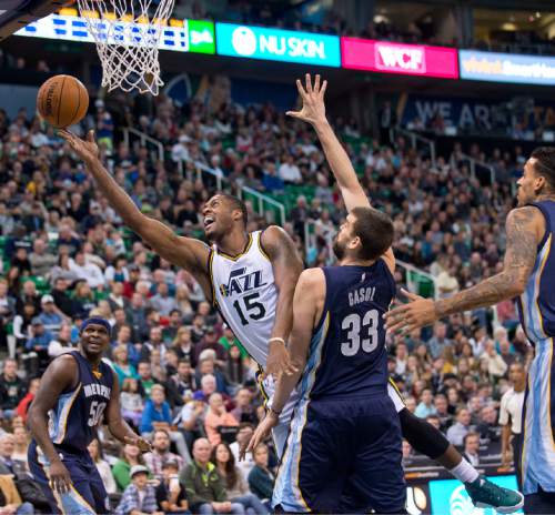 Lennie Mahler  |  The Salt Lake Tribune

Utah forward Derrick Favors scoops a shot in past Memphis center Marc Gasol in the first half of a game against the Memphis Grizzlies at Vivint Smart Home Arena on Saturday, Nov. 7, 2015.