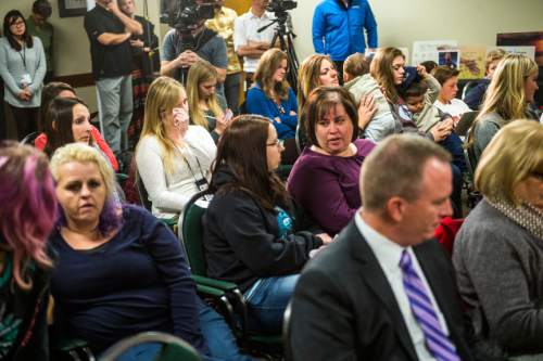 Chris Detrick  |  The Salt Lake Tribune
Family members who lost a child in a motor vehicle crash in 2014 listen during a press conference at the Utah Department of Health Wednesday November 18, 2015. In 2014, 29 teens were killed on Utah roads.