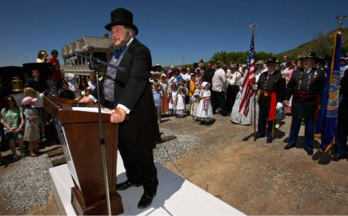 Steve Griffin  |  The Salt Lake Tribune

Brigham Young, played by James Arrington, introduces Utah governor Jon Huntsman during the Golden Spike re-enactment ceremony at the This is the Place Heritage Park in Salt Lake City May 10, 2007.