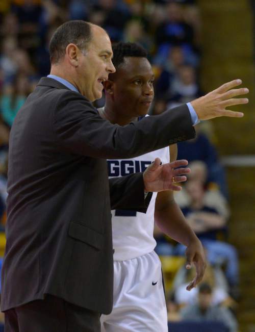 Leah Hogsten  |  The Salt Lake Tribune
Utah State Aggies head coach Tim Duryea talks with Utah State Aggies guard Darius Perkins (2). Utah State Aggies defeated Adams State Grizzlies, 83-68, Tuesday, November 17, 2015 at Smith Spectrum.