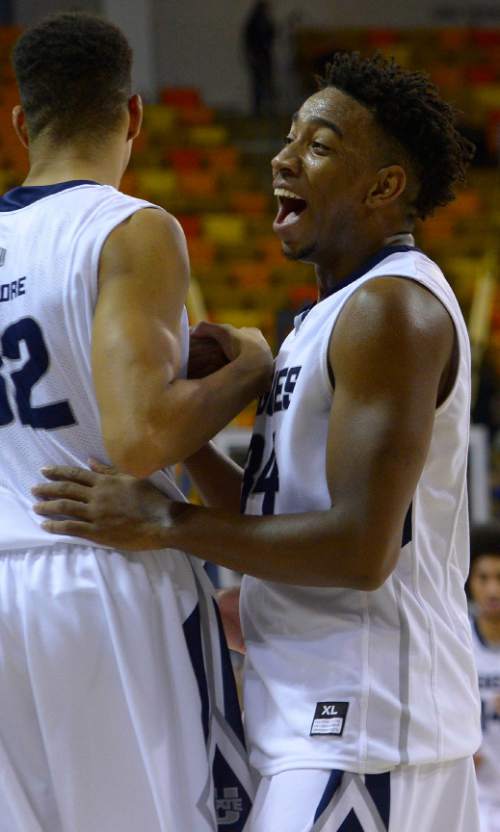 Leah Hogsten  |  The Salt Lake Tribune
Utah State Aggies guard Chris Smith (34) walks off the court all smiles after posting 21 points in the win. Utah State Aggies defeated Adams State Grizzlies, 83-68, Tuesday, November 17, 2015 at Smith Spectrum.