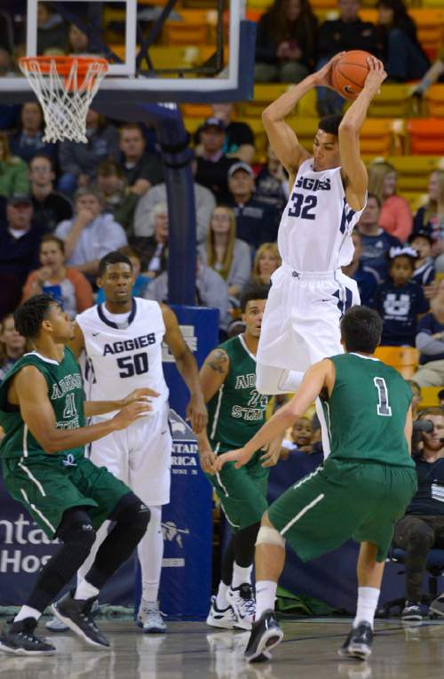 Leah Hogsten  |  The Salt Lake Tribune
Utah State Aggies forward Grayson Moore (32) pulls down the rebound. Utah State Aggies leads Adams State Grizzlies, 47-27, Tuesday, November 17, 2015 at Smith Spectrum.