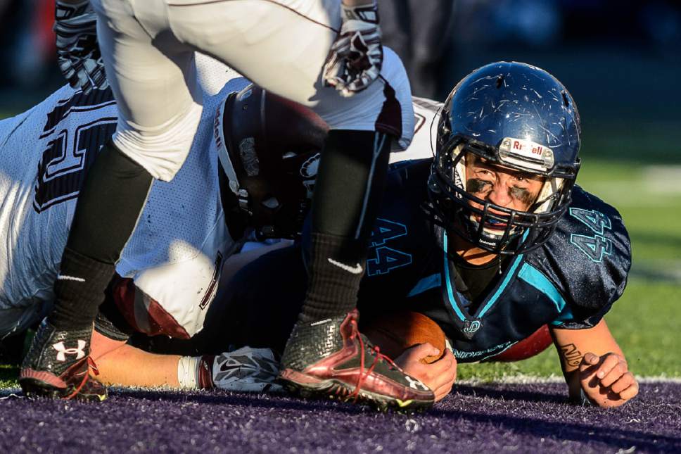 Trent Nelson  |  The Salt Lake Tribune
Juan Diego's Tristen Tonozzi (44) scores a touchdown as Juan Diego defeats Morgan in the 3A high school football championship game at Weber State in Ogden, Saturday November 14, 2015.