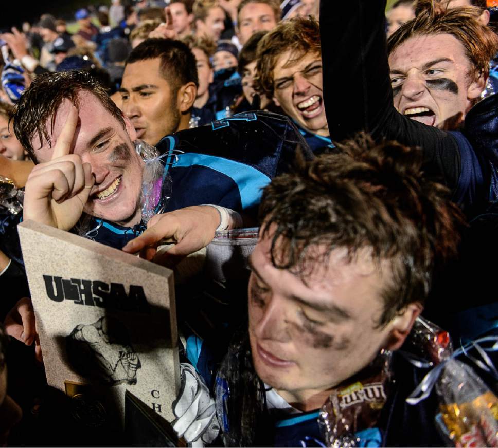 Trent Nelson  |  The Salt Lake Tribune
Juan Diego players celebrate as Juan Diego defeats Morgan in the 3A high school football championship game at Weber State in Ogden, Saturday November 14, 2015.