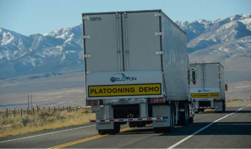 Francisco Kjolseth | The Salt Lake Tribune
UDOT and Peloton Technology host a live demonstration of new "connected vehicle" technology. The system which allows two semi-trucks to platoon together, similar to drafting off a bicycle, were demonstrated along I-80 North of Tooele. The two trucks connect within 30 to 100 feet of each depending on conditions, simultaneously brake, accelerate and react to road hazards up to 800 feet away in order to reduce fuel costs and increase safety by cutting down on reaction time in braking.