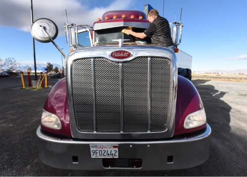 Francisco Kjolseth | The Salt Lake Tribune
Marty Taft, a senior technician with Peloton Technology readies a truck for a live demonstration of new "connected vehicle" technology. The system which allows two semi-trucks to platoon together, similar to drafting off a bicycle, were demonstrated along I-80 North of Tooele. The two trucks connect within 30 to 100 feet of each depending on conditions, simultaneously brake, accelerate and react to road hazards up to 800 feet away in order to reduce fuel costs and increase safety by cutting down on reaction time in braking.
