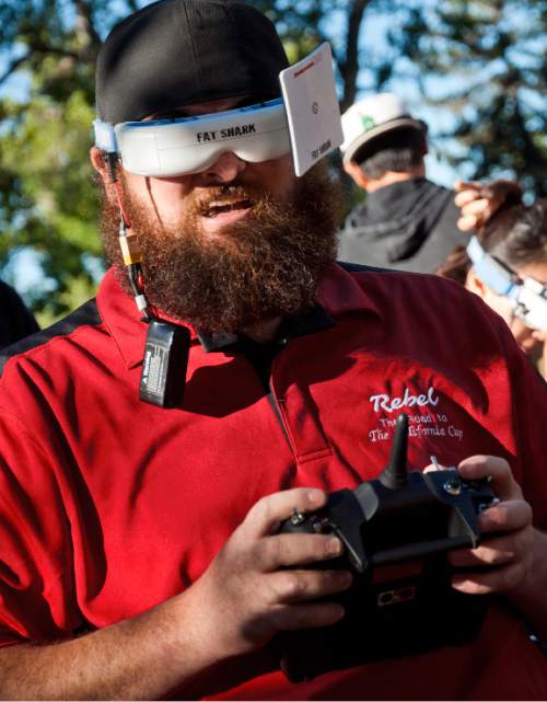 Michael Mangum  |  Special to the Tribune
Christian Petersen, of Provo, races his drone through the obstacle course with his wireless video goggles and RF receiver over his eyes during the first Utah Cup drone race at Warm Springs Park in Salt Lake City on Saturday.