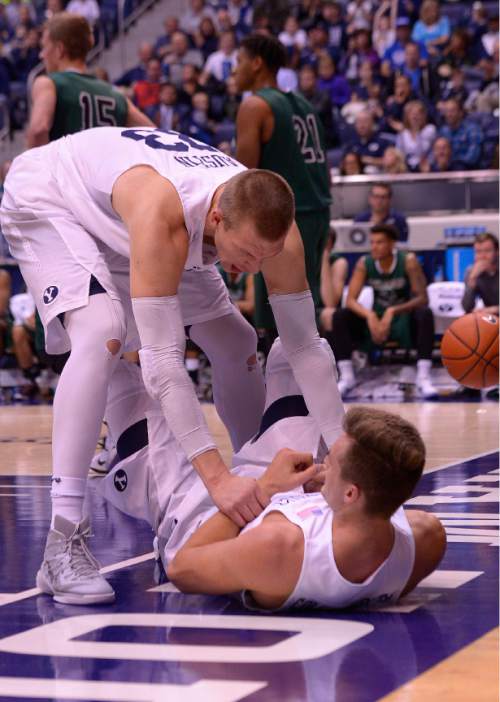 Leah Hogsten  |  The Salt Lake Tribune
Brigham Young Cougars forward Nate Austin (33) congratulates Brigham Young Cougars guard Kyle Collinsworth (5) for his driving play. Brigham Young University leads Adams State Grizzlies, 42-29 at the halfNovember 20, 2015 at Marriott Center, Provo.