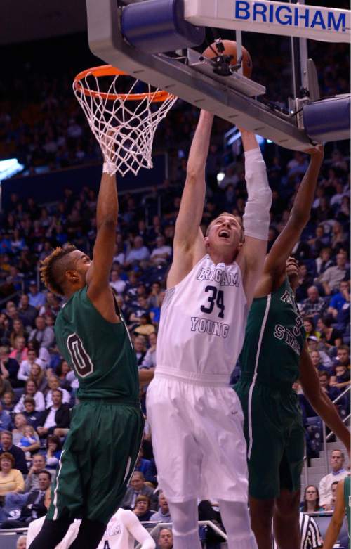 Leah Hogsten  |  The Salt Lake Tribune
Brigham Young Cougars forward Jakob Hartsock (34) fights for two over Adams State Grizzlies forward DJ Morgan (3). Brigham Young University leads Adams State Grizzlies, 42-29 at the halfNovember 20, 2015 at Marriott Center, Provo.