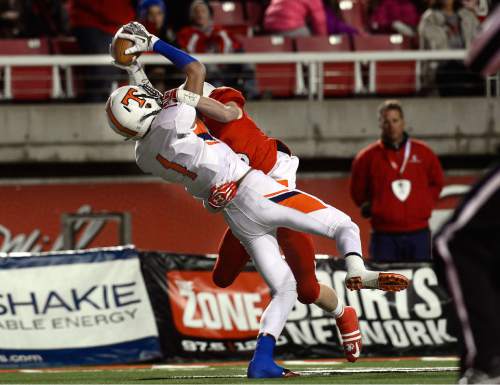 Scott Sommerdorf   |  The Salt Lake Tribune
With East DB Jordan Anderson (18) draped all over him, Timpview WR Samson Nacua (1) still made this catch inside the 5 yard line to set up a Timpview TD. East led Timpview 21-14 at the half in the 4A championship game, Friday, November 20, 2015.