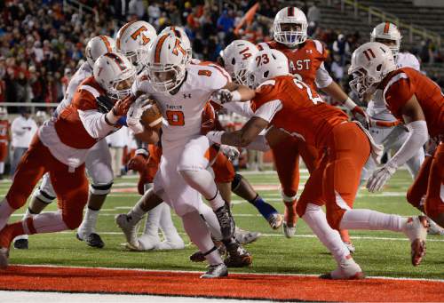 Scott Sommerdorf   |  The Salt Lake Tribune
Timpview RB Saia Folaumahina (8) scores to tie the game at 14-14 during first half play. East led Timpview 21-14 at the half in the 4A championship game, Friday, November 20, 2015.
