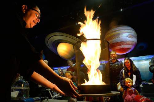 Scott Sommerdorf   |  The Salt Lake Tribune
Holly Anderson demonstrates a "Fire Tornado" during Clark Planetarium's celebration of it's 50th anniversary of having a planetarium in Salt Lake City, Saturday, November 21, 2015.