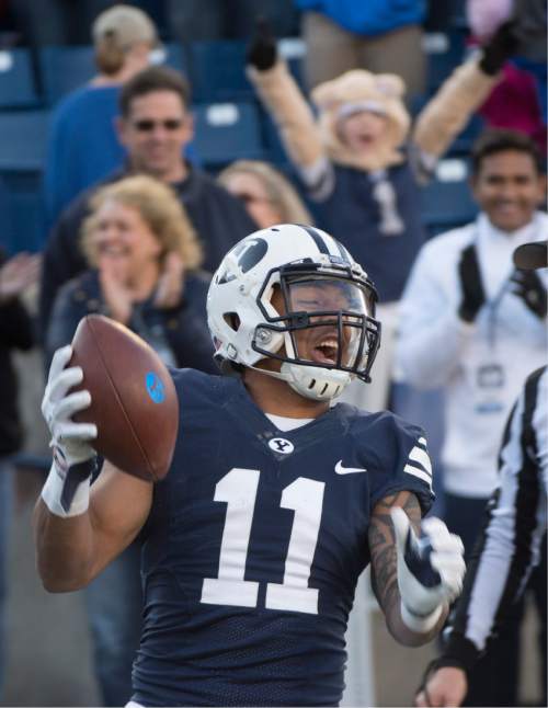 Rick Egan  |  The Salt Lake Tribune

Brigham Young wide receiver Terenn Houk (11) celebrates his 4th quarter touchdown for the Cougars, as BYU defeated the The Fresno Bulldogs 52 -10, at Lavell Edwards stadium, Tuesday, November 21, 2015.