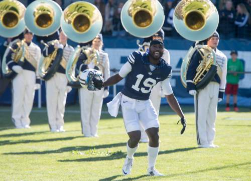 Rick Egan  |  The Salt Lake Tribune

Brigham Young Cougars wide receiver Devon Blackmon (19) does a little dance as he comes out with the BYU seniors, before the BYU vs. Fresno State, at Lavell Edwards stadium, Tuesday, November 21, 2015.