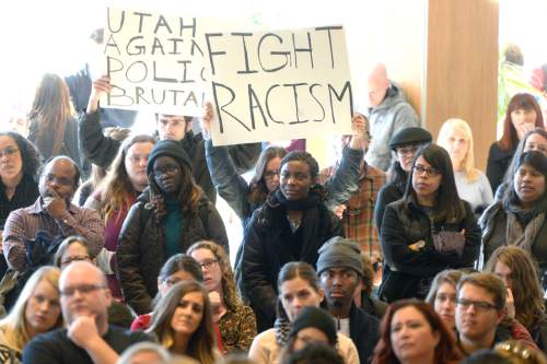 Al Hartmann  |  The Salt Lake Tribune
Students filled the auditorium at Olpin Union building at the University of Utah on Friday for an open discussion on the school's attempts at inclusivness and fairness to it's minority students. A handful of minority students in the crowd held a silent protest during the discussion with signs and taped mouths saying the university doesn't do enough to represent them. The protestors were welcome but most students used the time to listen and vocalize their problems with the school's lack of support programs for minority students and what it could do better.