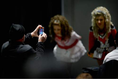 Scott Sommerdorf   |  The Salt Lake Tribune
A father makes a photo of his daughter after her performance as Utah hosted the Western Regional Championships of Irish Dance (The Western Regional Oireachtas) at the Salt Palace Convention Center, Sunday, November 22, 2015.