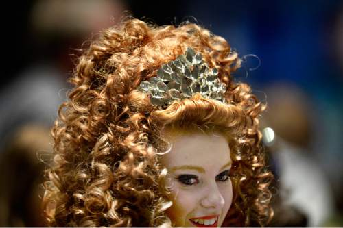 Scott Sommerdorf   |  The Salt Lake Tribune
An Irish dancer displays one of the large, curly wigs that are common in the sport as Utah hosted the Western Regional Championships of Irish Dance (The Western Regional Oireachtas) at the Salt Palace Convention Center, Sunday, November 22, 2015.