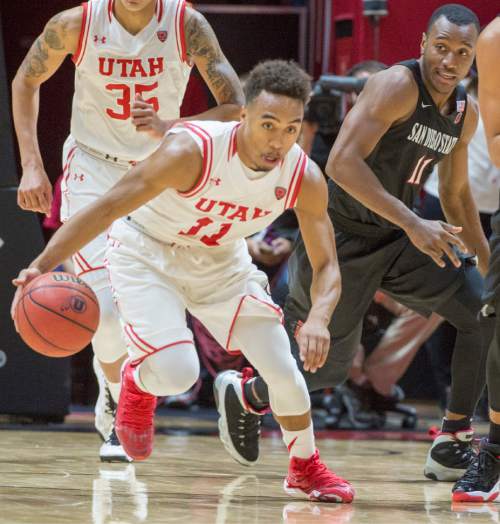 Rick Egan  |  The Salt Lake Tribune

Utah guard Brandon Taylor (11) takes the ball down court, after stealing it from San Diego State Aztecs guard D'Erryl Williams (11), in basketball action, as the Utes defeated the San Diego State Aztecs 81-76, at the Huntsman Center, Tuesday, November 10, 2015.