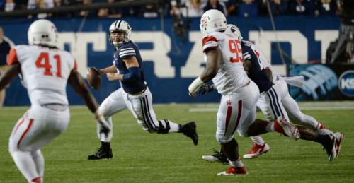 Steve Griffin  |  The Salt Lake Tribune


BYU Cougars quarterback Taysom Hill (4) scrambles out of the pocket as he looks to run in the second half of the  game between BYU and Houston and LaVell Edwards Stadium in Provo, Thursday, September 11, 2014.