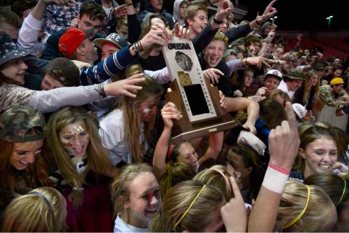 Scott Sommerdorf   |  The Salt Lake Tribune
Davis High fans get a chance to celebrate with the trophy after Davis beat Weber 1-0 for the girl's 5A title at Rio Tinto stadium, Friday, October 23, 2015.