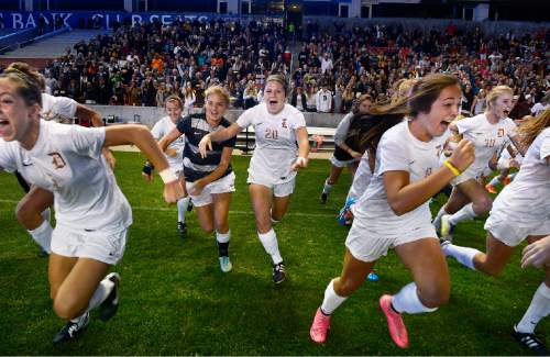 Scott Sommerdorf   |  The Salt Lake Tribune
Davis players rush out onto the field as the final seconds tick off the clock. Davis beat Weber 1-0 for the girl's 5A title at Rio Tinto stadium, Friday, October 23, 2015.
